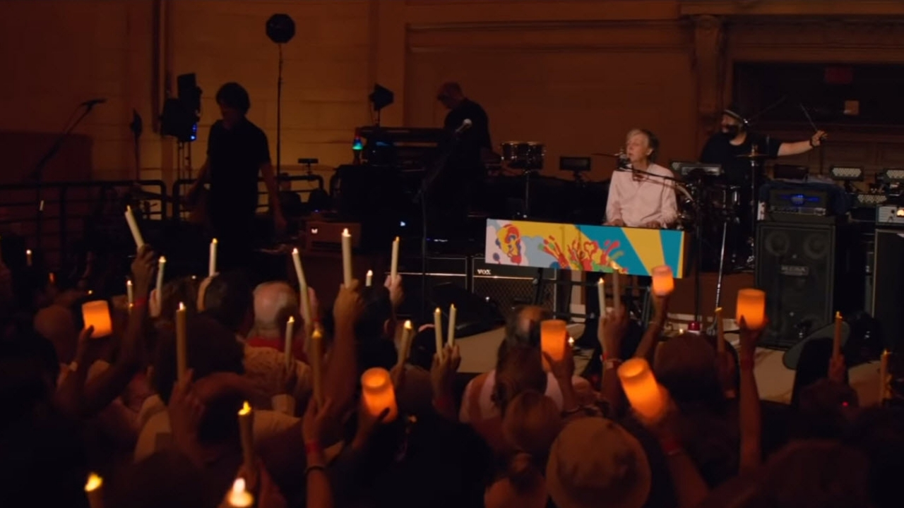 McCartney playing "Let it Be" at his secret NYC concert, with the audience holding candles.